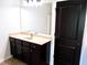 Vanity with dark wood cabinets at 2338 Newbury Oaks Dr, Lawrenceville, GA 30044