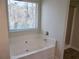 Soaking tub with window and shower at 2338 Newbury Oaks Dr, Lawrenceville, GA 30044