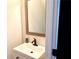 Small bathroom with single sink and framed mirror at 2338 Newbury Oaks Dr, Lawrenceville, GA 30044