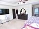 Main bedroom with dresser and large bed at 2338 Newbury Oaks Dr, Lawrenceville, GA 30044