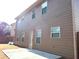 Rear view of house showing patio and siding at 2338 Newbury Oaks Dr, Lawrenceville, GA 30044