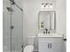 Modern bathroom with white vanity, black matte fixtures and glass shower at 351 Willowwind Dr, Loganville, GA 30052