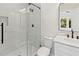 Stylish bathroom with marble shower, herringbone floor, and modern vanity at 351 Willowwind Dr, Loganville, GA 30052