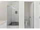 Modern bathroom with a frameless glass shower and separate toilet area at 351 Willowwind Dr, Loganville, GA 30052