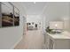 Bright entry hall with light wood flooring, leading to the living room at 351 Willowwind Dr, Loganville, GA 30052