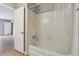 Clean bathroom with a tub and shower, and white tile at 1150 Collier Nw Rd # J11, Atlanta, GA 30318