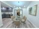 Elegant dining room with glass-top table and French doors at 1933 Matthew Way, Lithonia, GA 30058