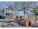 Two-story craftsman home, gray siding, brick accents, front porch at 249 Josephine Ne St, Atlanta, GA 30307