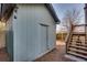 Detached shed with a wooden door and stairs leading to a deck at 249 Josephine Ne St, Atlanta, GA 30307