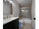 Updated bathroom with a glass shower and dark wood-look floors at 574 Pool Rd, Hiram, GA 30141