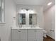Updated bathroom with double vanity and modern fixtures at 574 Pool Rd, Hiram, GA 30141