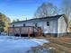 Back exterior view showing a deck and propane tank at 574 Pool Rd, Hiram, GA 30141