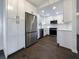 Modern kitchen with white cabinets and stainless steel appliances at 574 Pool Rd, Hiram, GA 30141