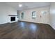 Bright living room featuring hardwood floors and a fireplace at 574 Pool Rd, Hiram, GA 30141