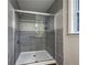 Large walk-in shower with gray tile and glass enclosure at 574 Pool Rd, Hiram, GA 30141
