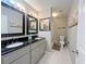 Bathroom with double vanity, dark countertop and shower/tub combo at 6520 Roswell Rd # 3, Atlanta, GA 30328