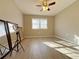 Sunlit bedroom featuring wood-look floors and a ceiling fan at 6520 Roswell Rd # 3, Atlanta, GA 30328