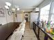 Bright dining room with a large table and kitchen views at 6520 Roswell Rd # 3, Atlanta, GA 30328