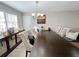 Spacious dining area featuring a long wooden table at 6520 Roswell Rd # 3, Atlanta, GA 30328