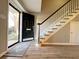 Two-story entryway with hardwood floors and staircase at 6520 Roswell Rd # 3, Atlanta, GA 30328