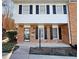 Two-story brick townhouse with black shutters at 6520 Roswell Rd # 3, Atlanta, GA 30328