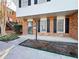 Two-story brick townhouse with black shutters at 6520 Roswell Rd # 3, Atlanta, GA 30328