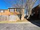 Brick townhouse with wooden fence and landscaping at 6520 Roswell Rd # 3, Atlanta, GA 30328