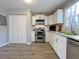 Modern kitchen with stainless steel appliances and white cabinets at 6520 Roswell Rd # 3, Atlanta, GA 30328