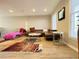 Living Room with sectional sofa, chaise lounge and large TV at 6520 Roswell Rd # 3, Atlanta, GA 30328