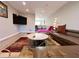 Living Room with sectional sofa, chaise lounge and large TV at 6520 Roswell Rd # 3, Atlanta, GA 30328