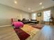Spacious living room featuring a plush chaise lounge and modern furniture at 6520 Roswell Rd # 3, Atlanta, GA 30328