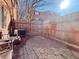 Cozy brick patio with seating area and wooden fence at 6520 Roswell Rd # 3, Atlanta, GA 30328