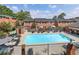 Community pool with lounge chairs and brick enclosure at 6520 Roswell Rd # 3, Atlanta, GA 30328