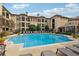 Community pool with surrounding lounge chairs at 955 Juniper Ne St # 1016, Atlanta, GA 30309