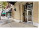 Close-up of building entrance with glass doors and street view at 123 Luckie Nw St # 2210, Atlanta, GA 30303