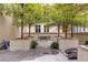 Tranquil courtyard with seating, trees, and planters at 123 Luckie Nw St # 2210, Atlanta, GA 30303