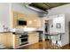 Modern kitchen featuring stainless steel appliances and light wood cabinets at 123 Luckie Nw St # 2210, Atlanta, GA 30303