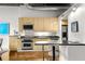 Modern kitchen with stainless steel appliances and light wood cabinets at 123 Luckie Nw St # 2210, Atlanta, GA 30303