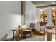 Open living area with large windows, hardwood floors and modern furniture at 123 Luckie Nw St # 2210, Atlanta, GA 30303