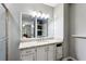 Bathroom with granite countertop vanity and a large mirror at 1741 Charrington Way, Powder Springs, GA 30127