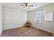 Bright bedroom featuring a shiplap accent wall and carpeted floor at 1741 Charrington Way, Powder Springs, GA 30127