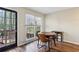 Charming dining area with wood table and chairs, near sliding glass door at 1741 Charrington Way, Powder Springs, GA 30127