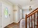 Entryway with wooden floors, staircase, and neutral walls at 1741 Charrington Way, Powder Springs, GA 30127