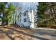 Two-story house with white siding and a long driveway at 1741 Charrington Way, Powder Springs, GA 30127