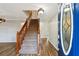 Wooden staircase with carpeted steps and wooden railing at 1741 Charrington Way, Powder Springs, GA 30127