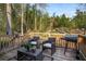 Relaxing back deck with wicker chairs, table, and grill at 257 Rock Garden Nw Ter, Marietta, GA 30064