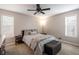 Spacious bedroom with a queen bed and ceiling fan at 257 Rock Garden Nw Ter, Marietta, GA 30064