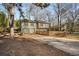 Two-story house with driveway and trees at 257 Rock Garden Nw Ter, Marietta, GA 30064