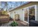 Green house exterior with wooden deck and sliding glass door at 257 Rock Garden Nw Ter, Marietta, GA 30064