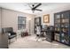 Home office featuring a desk, bookshelves, and guitar at 257 Rock Garden Nw Ter, Marietta, GA 30064